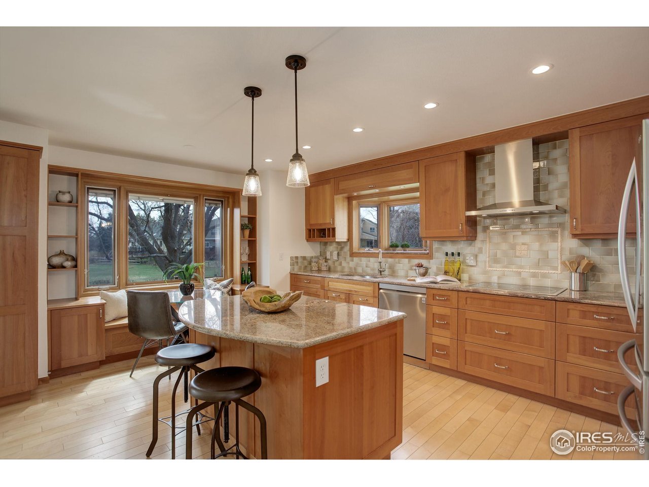 4462 Wellington Road Boulder, CO 80301 - Photo 16 of 37 a kitchen with sink dining table and chairs