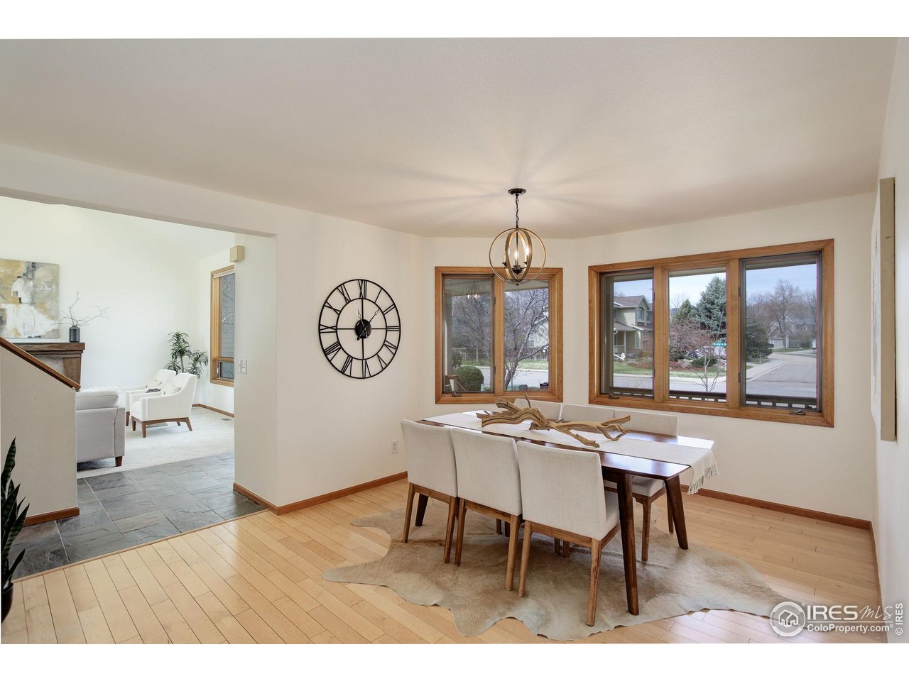 4462 Wellington Road Boulder, CO 80301 - Photo 18 of 37 a view of a dining room with furniture window and wooden floor