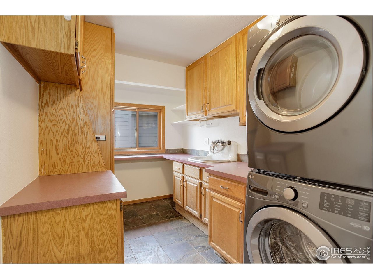 4462 Wellington Road Boulder, CO 80301 - Photo 20 of 37 a kitchen with a sink a washer and dryer