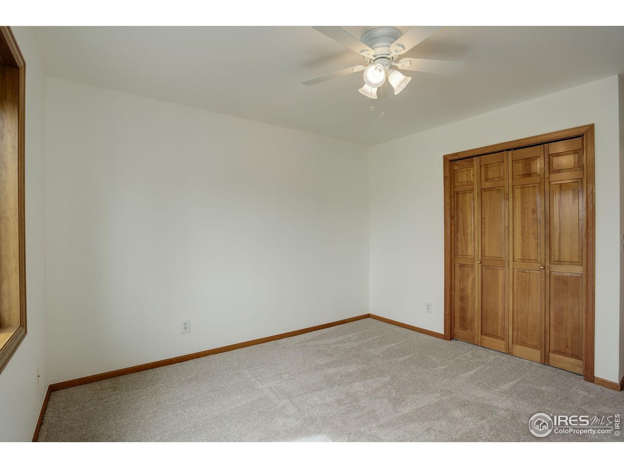 4462 Wellington Road Boulder, CO 80301 - Photo 28 of 37 a view of an empty room and a ceiling fan