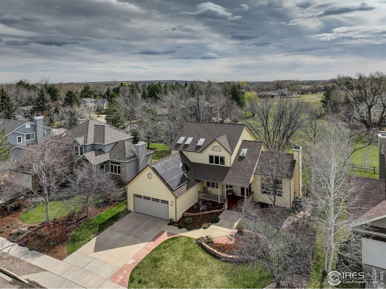 4462 Wellington Road Boulder, CO 80301 - Photo 3 of 37 an aerial view of a house with table and chairs