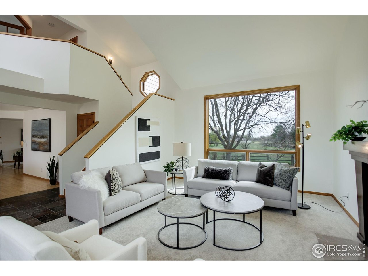 4462 Wellington Road Boulder, CO 80301 - Photo 9 of 37 a living room with furniture and a large window
