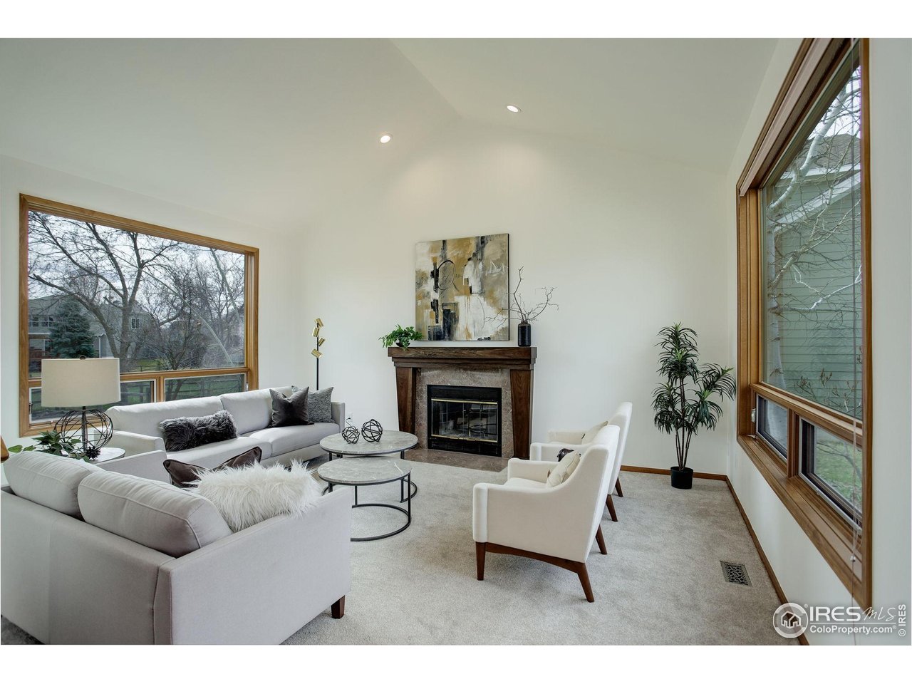 4462 Wellington Road Boulder, CO 80301 - Photo 10 of 37 a living room with furniture and a fireplace