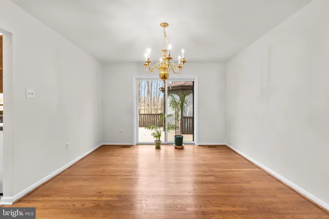 a kitchen with stainless steel appliances granite countertop a sink and a refrigerator