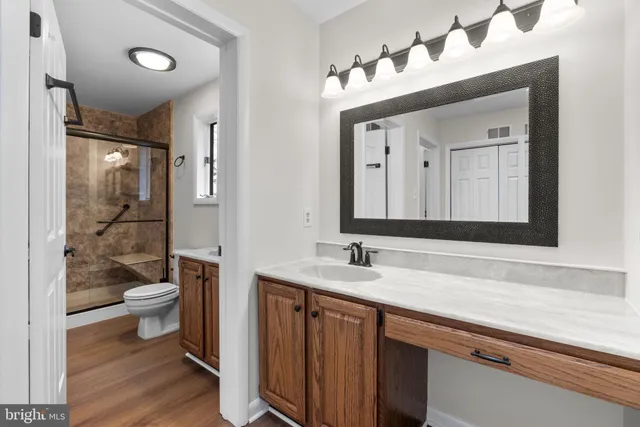 a view of a patio with wooden floor and fence