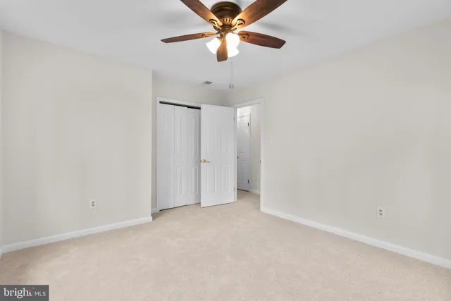 a view of a building with large trees