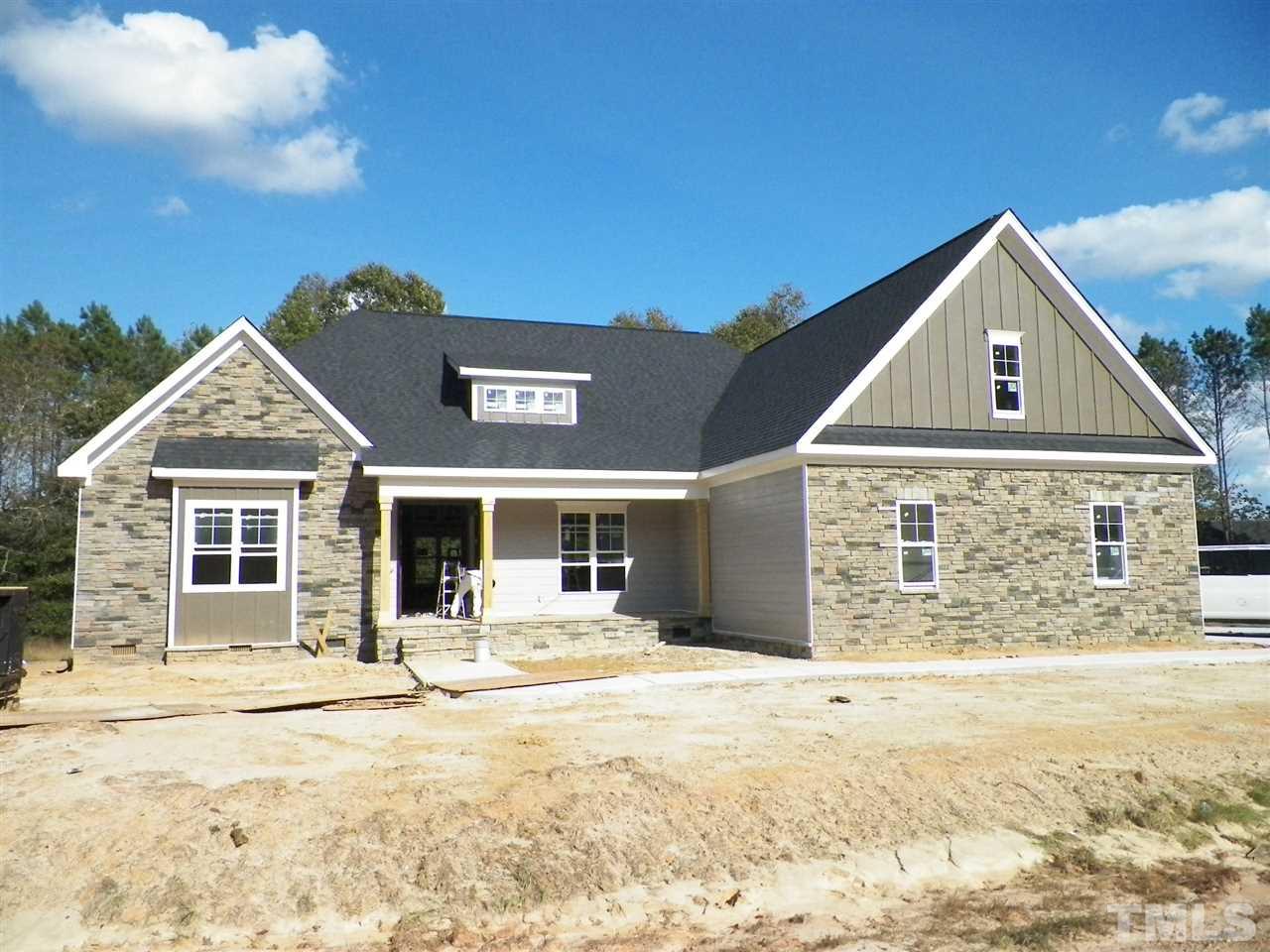 6113 Spring Branch Circle Raleigh, NC 27603 - Photo 1 of 22 a front view of a house with a yard