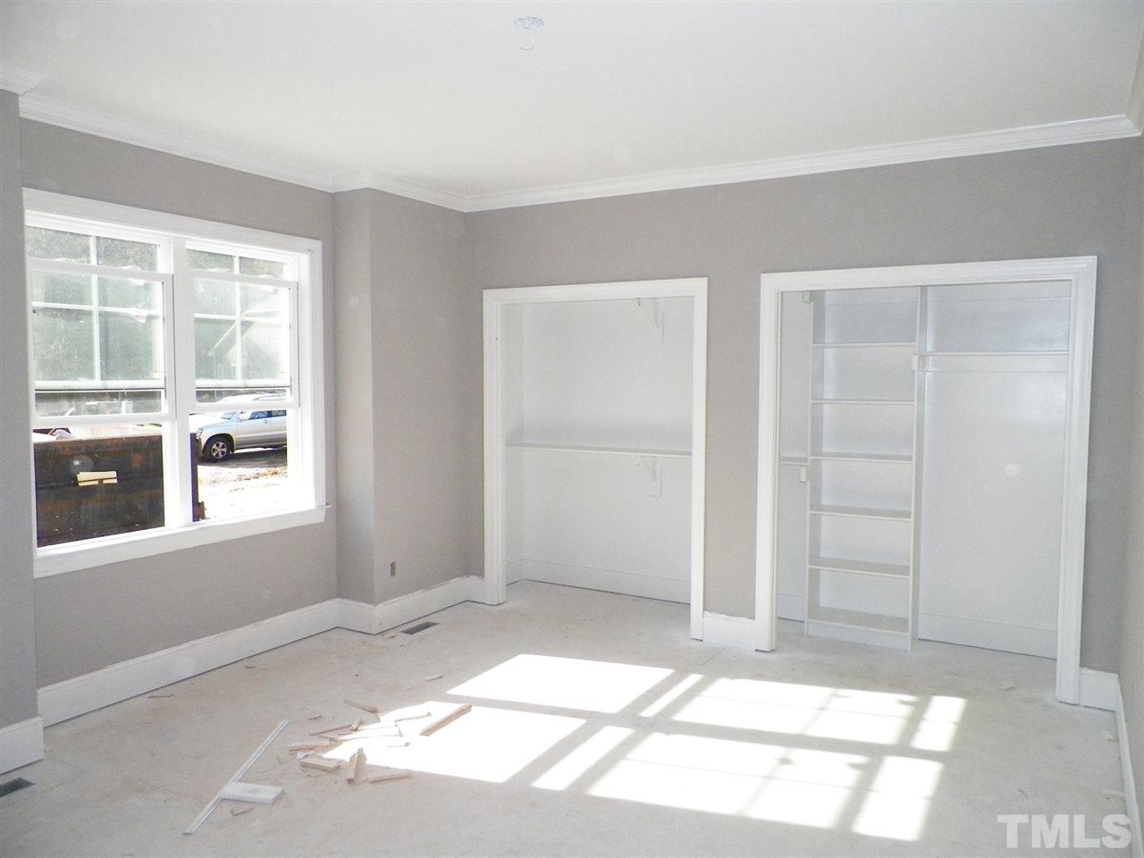 6113 Spring Branch Circle Raleigh, NC 27603 - Photo 13 of 22 a view of an empty room with a window