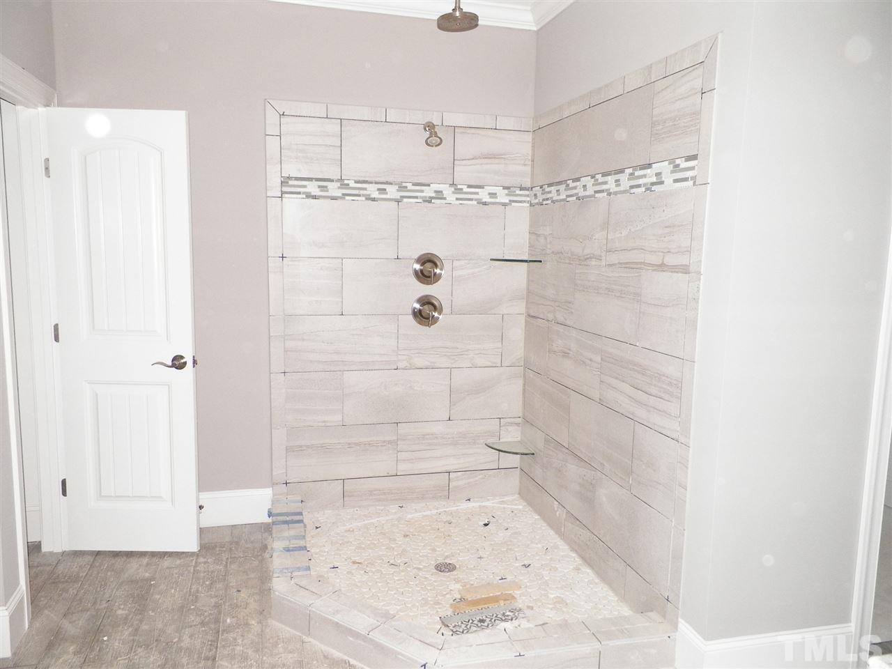 6113 Spring Branch Circle Raleigh, NC 27603 - Photo 15 of 22 a bathroom with a shower