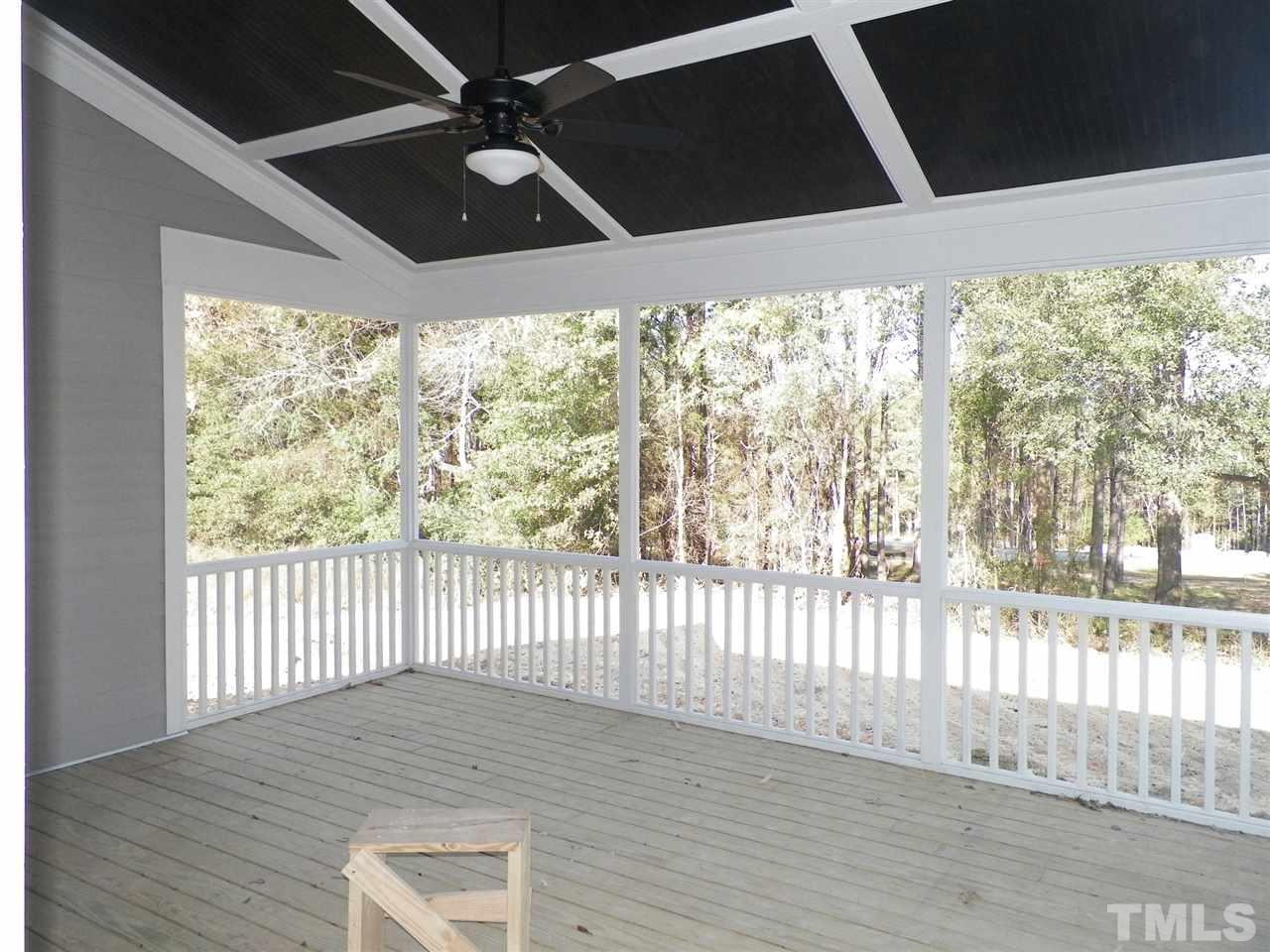 6113 Spring Branch Circle Raleigh, NC 27603 - Photo 19 of 22 a view of a porch with wooden floor