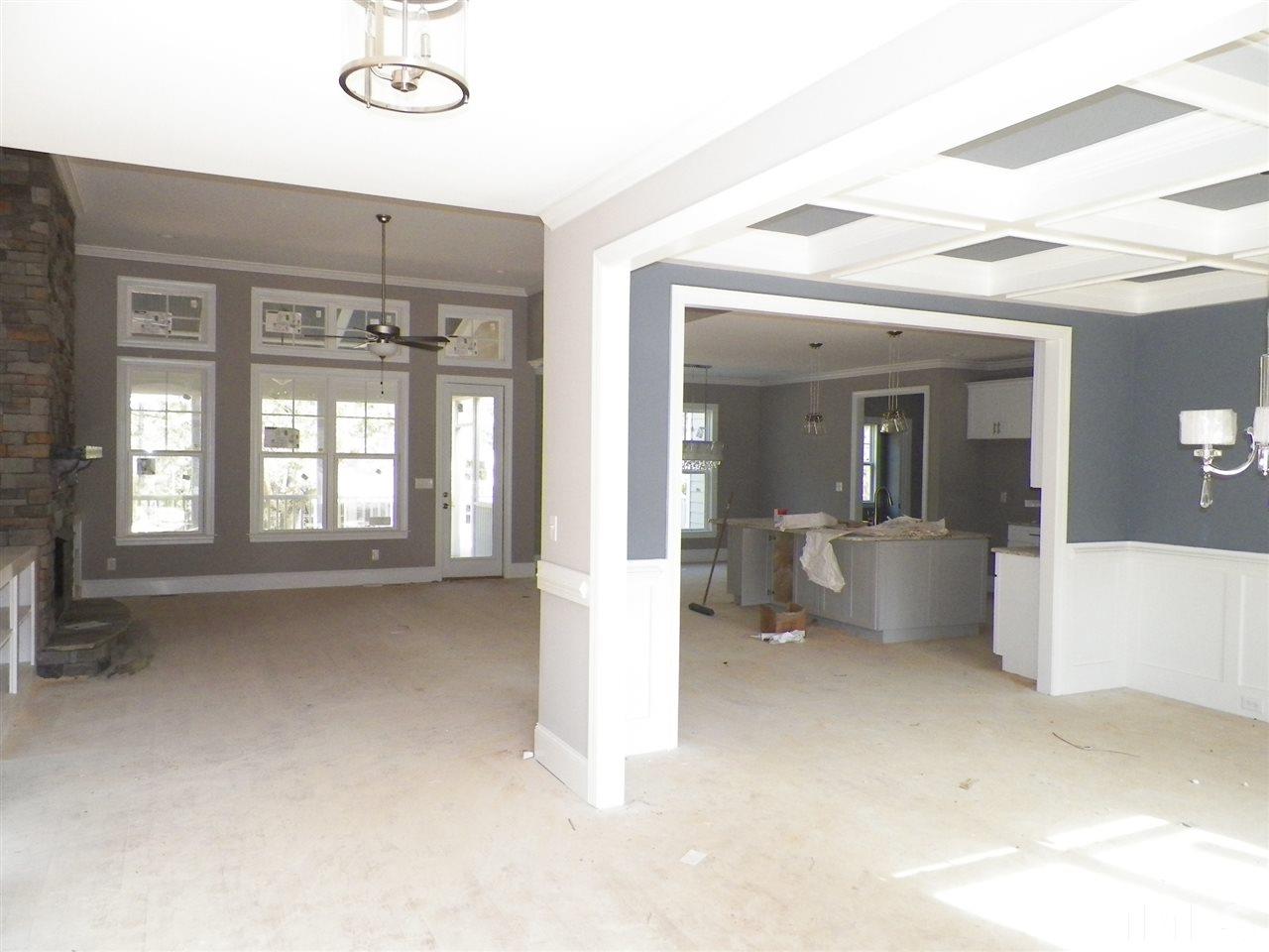 6113 Spring Branch Circle Raleigh, NC 27603 - Photo 3 of 22 a view of an empty room with a fireplace