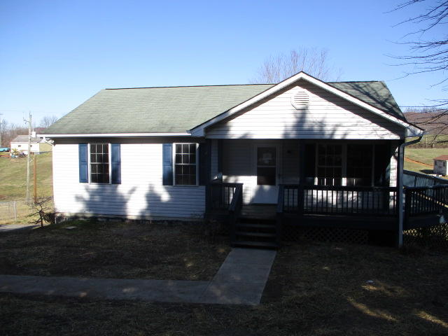 a front view of a house with yard
