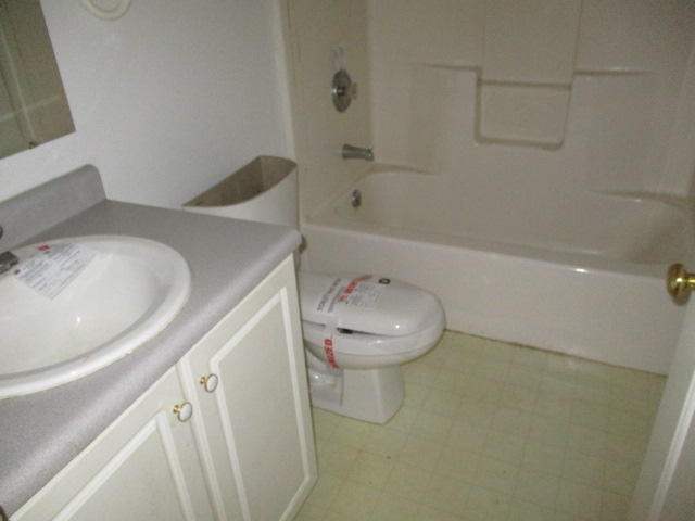 9739 Stewartsville Road Goodview, VA 24095 - Photo 7 of 11 a bathroom with a sink and toilet
