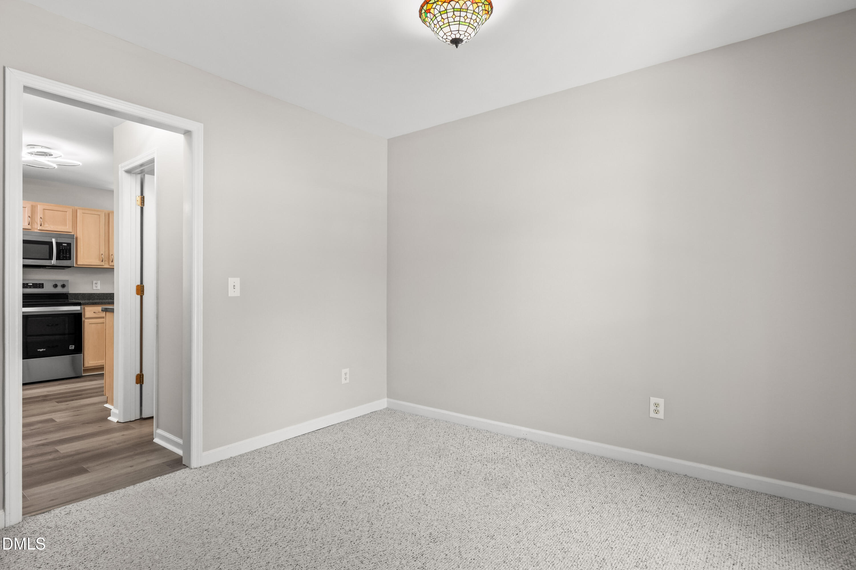 3015 Rennit Court Raleigh, NC 27603 - Photo 18 of 40 an empty room with kitchen view
