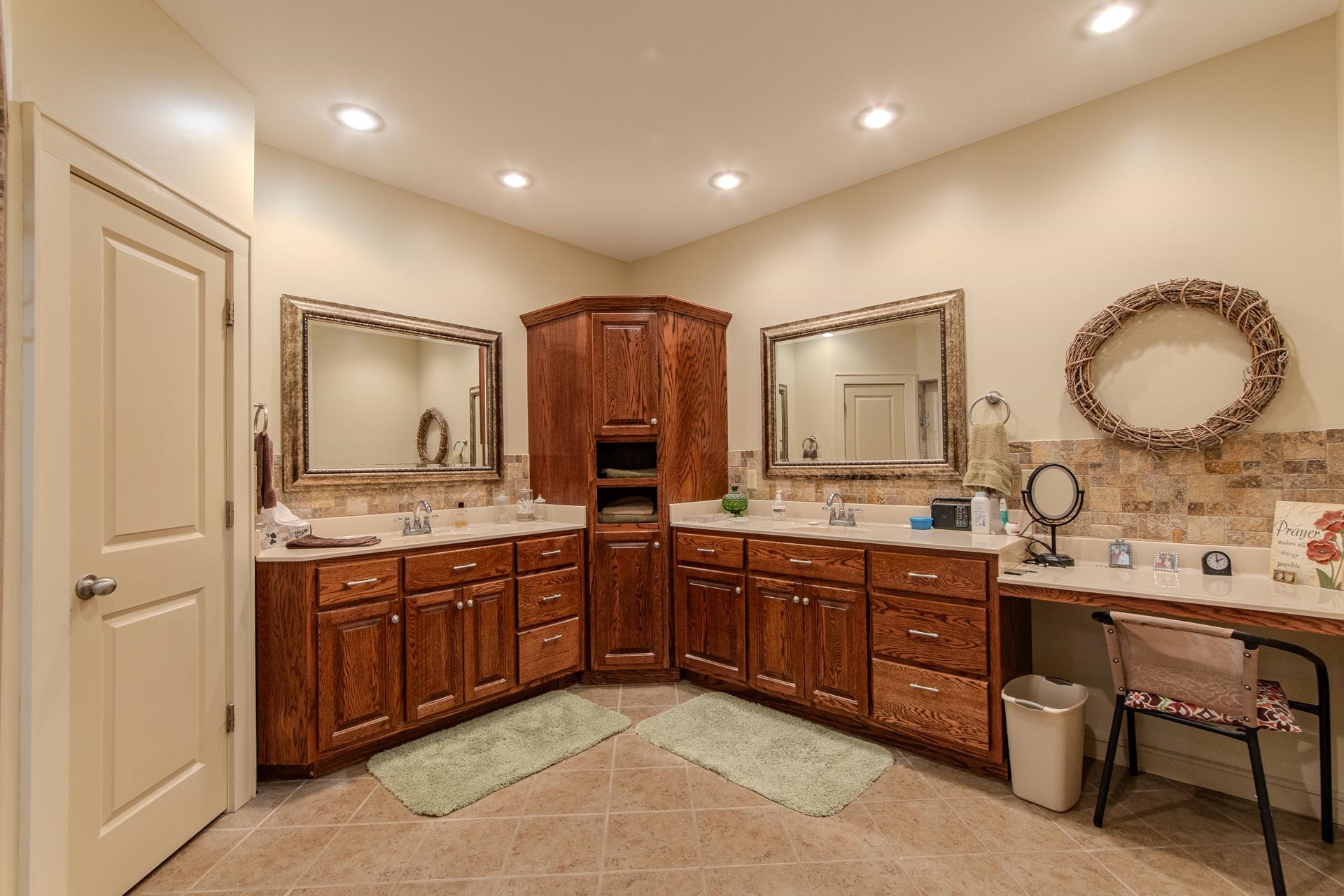 2690 Fellowship Road Sardis, TN 38371 - Photo 15 of 40 a spacious bathroom with a granite countertop sink and a mirror