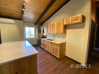 53551 West Ridge Road Idyllwild, CA 92549 - Photo 11 of 33 a kitchen with a sink stove and refrigerator