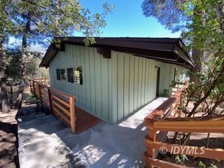 53551 West Ridge Road Idyllwild, CA 92549 - Photo 6 of 33 a front view of a house with a garden