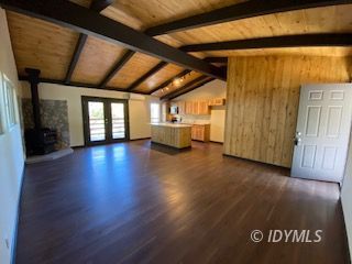 53551 West Ridge Road Idyllwild, CA 92549 - Photo 8 of 33 a view of an empty room with wooden floor and a window