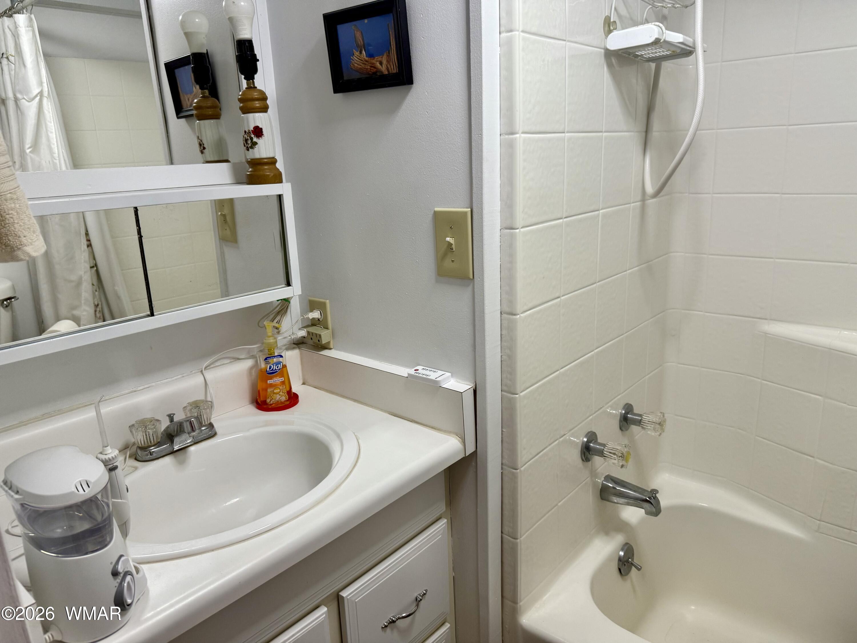 727 South Butler Street Eagar, AZ 85925 - Photo 20 of 32 a bathroom with a sink and a mirror