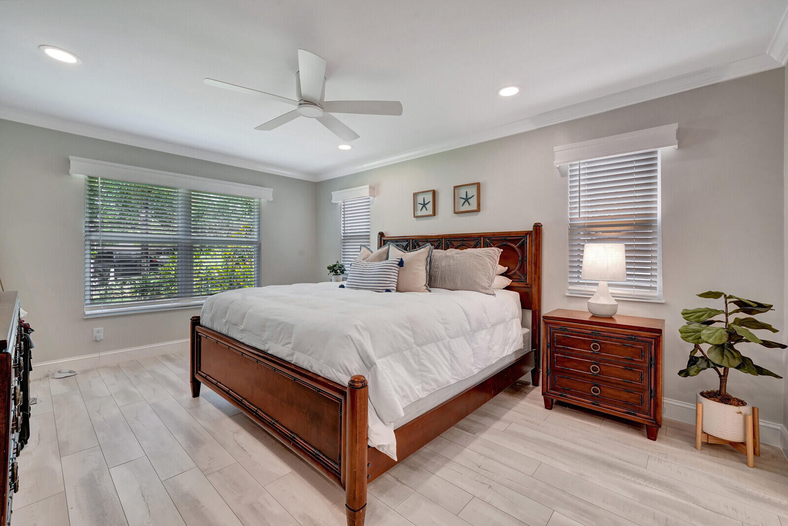 6009 Eagles Nest Drive Jupiter, FL 33458 - Photo 15 of 49 a bed sitting in a spacious bedroom next to a window