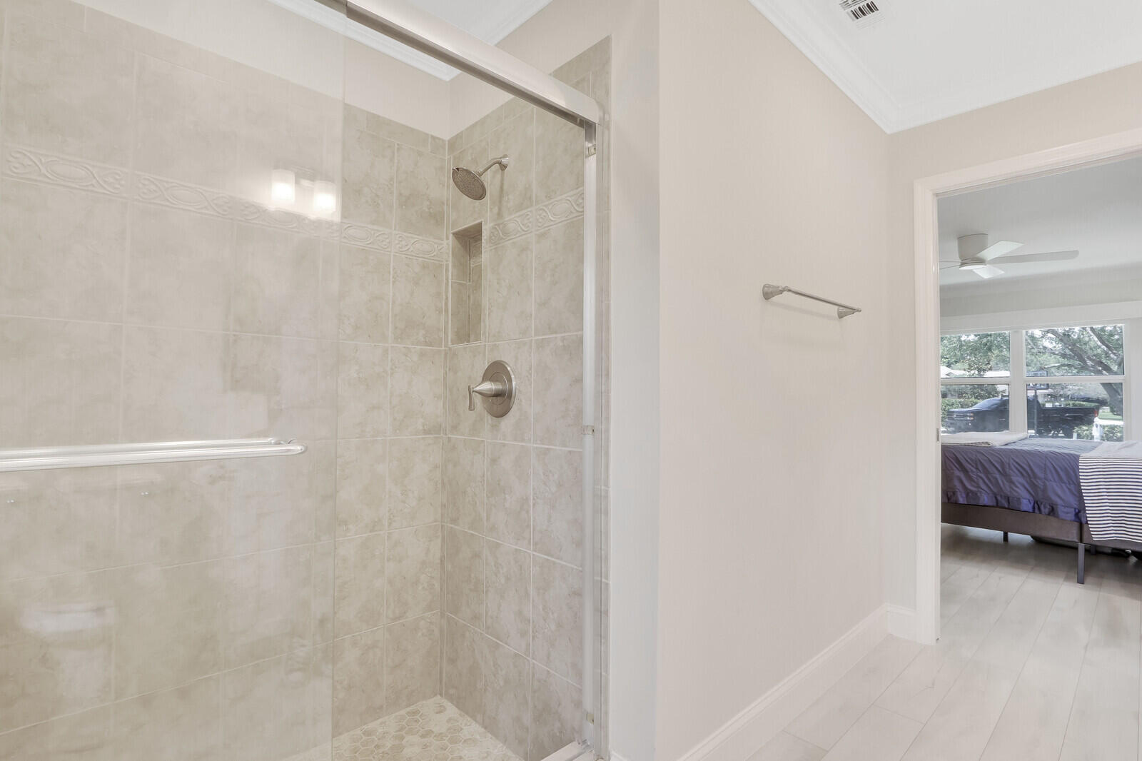 6009 Eagles Nest Drive Jupiter, FL 33458 - Photo 18 of 49 a bathroom with a shower and a view of bathroom