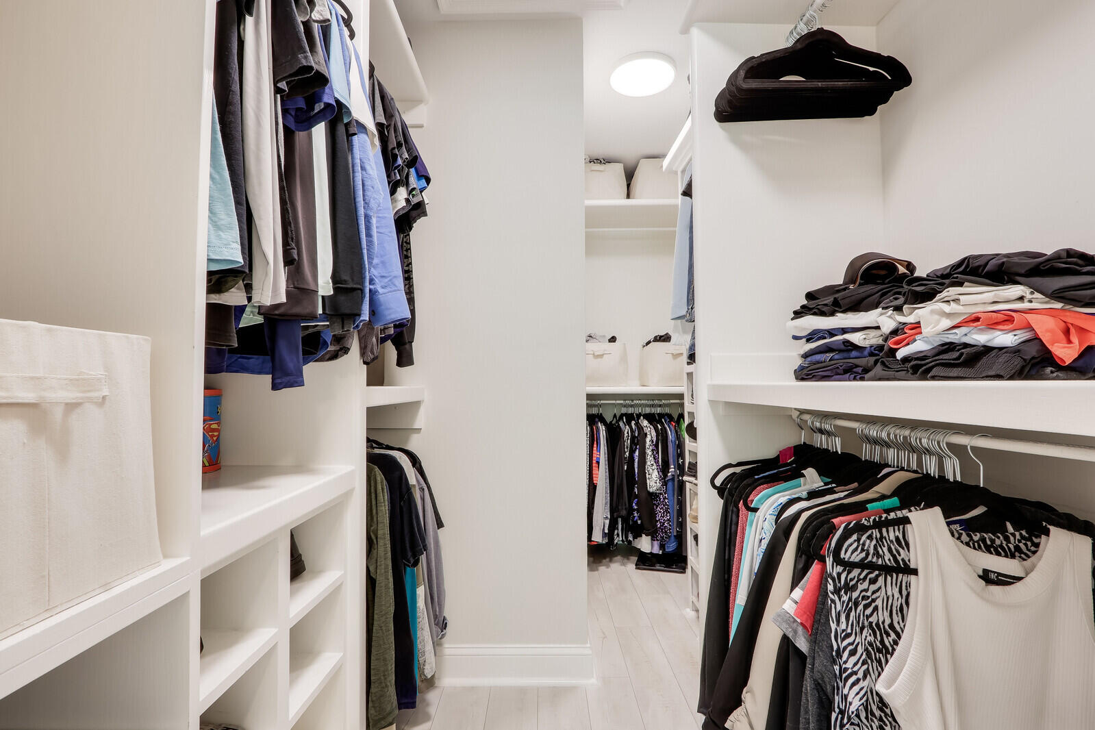 6009 Eagles Nest Drive Jupiter, FL 33458 - Photo 19 of 49 a view of walk in closet with clothes and shoes