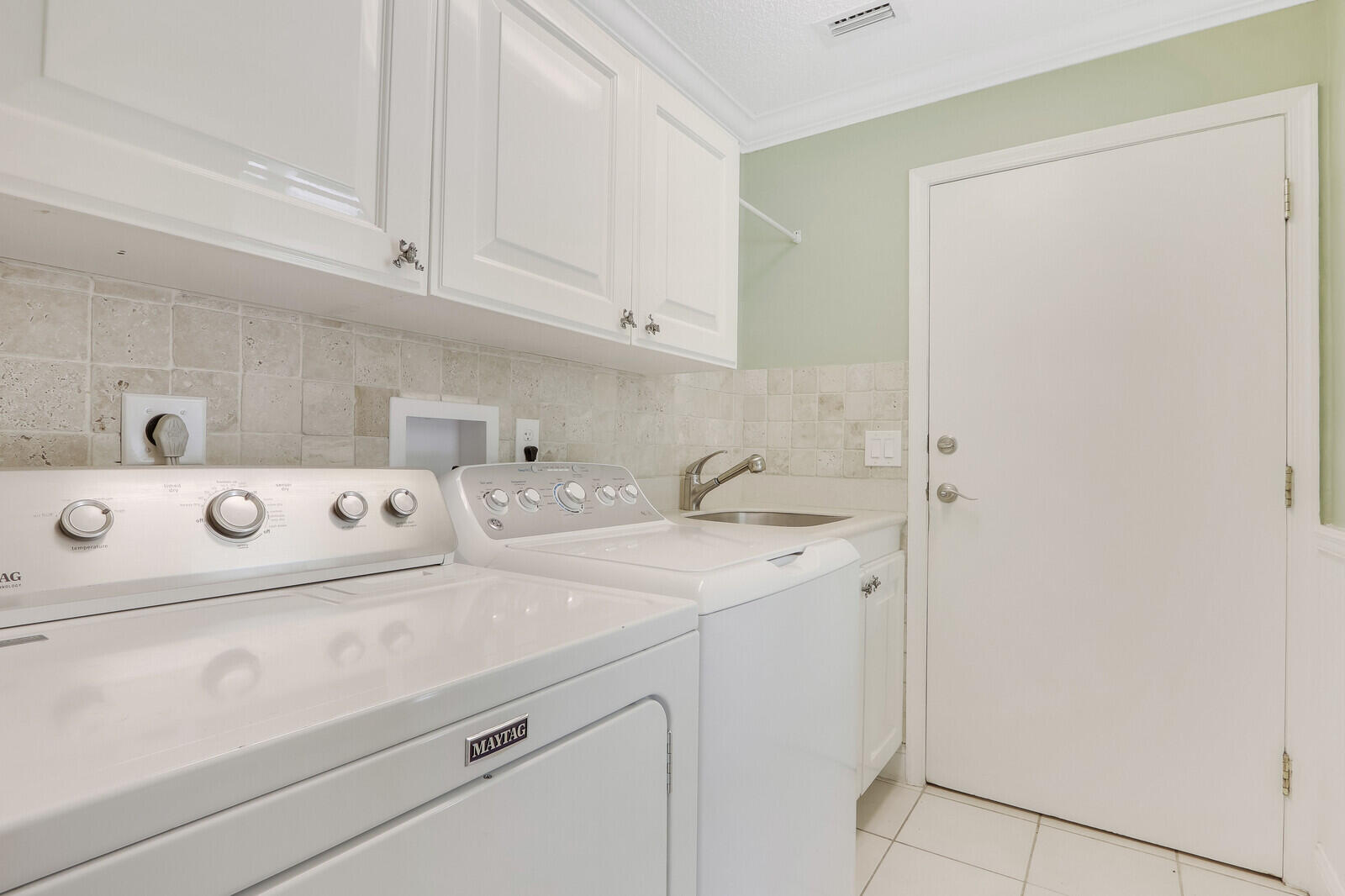 6009 Eagles Nest Drive Jupiter, FL 33458 - Photo 20 of 49 a utility room with dryer and washer