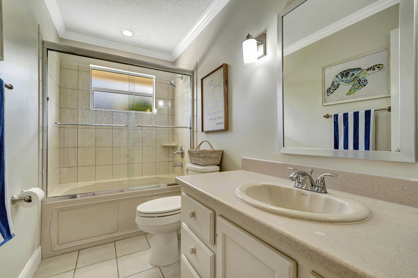 6009 Eagles Nest Drive Jupiter, FL 33458 - Photo 25 of 49 a bathroom with a sink toilet and shower