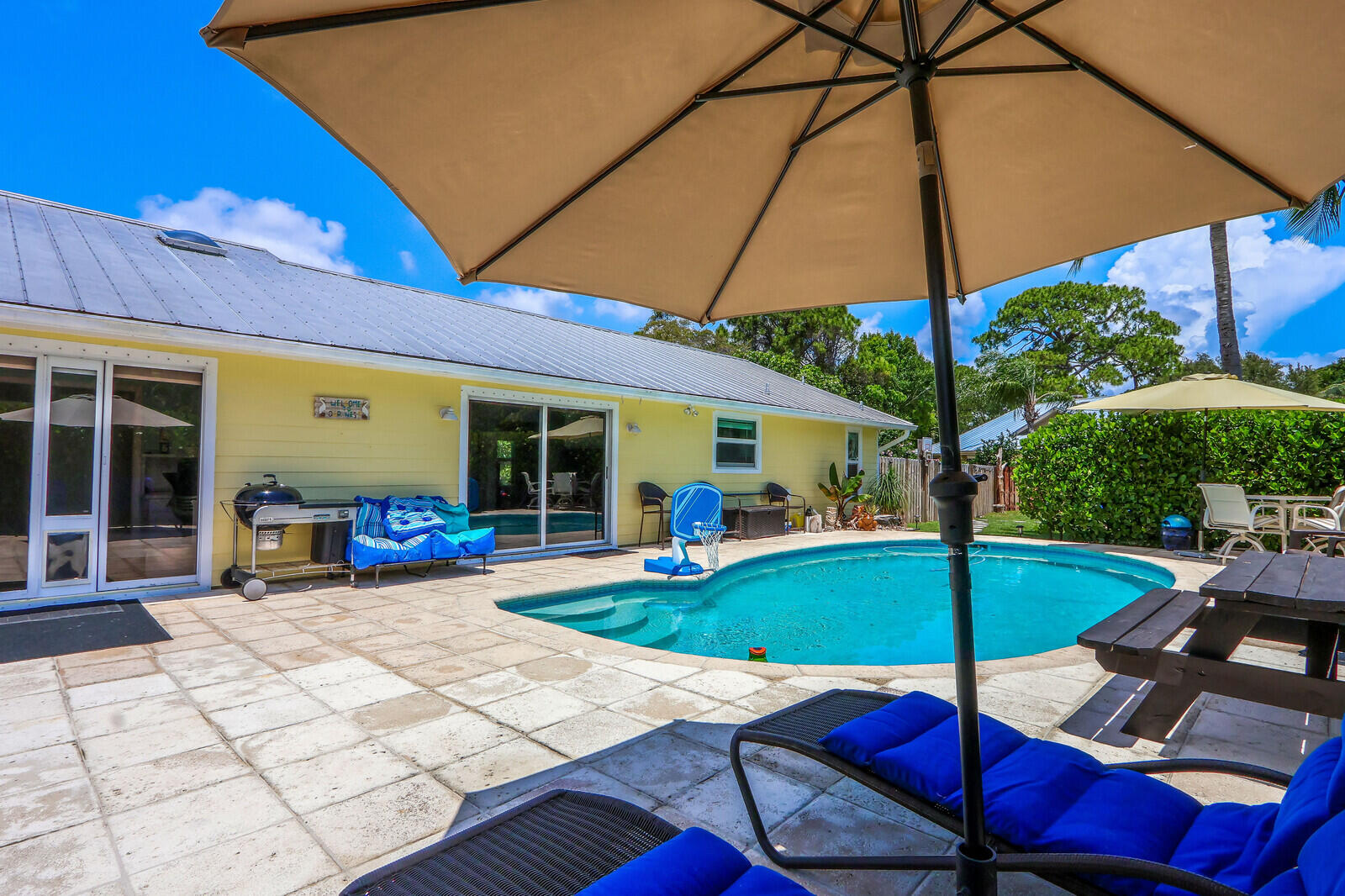 6009 Eagles Nest Drive Jupiter, FL 33458 - Photo 27 of 49 a view of a house with backyard and sitting area