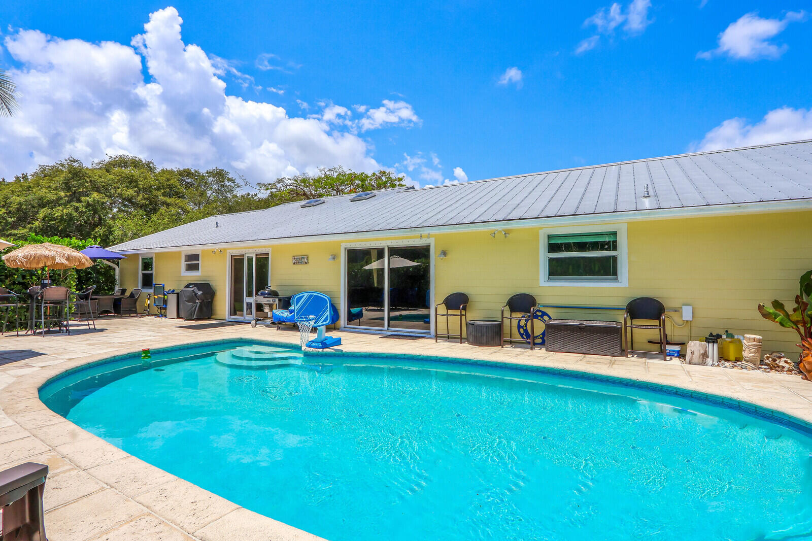 6009 Eagles Nest Drive Jupiter, FL 33458 - Photo 29 of 49 a view of a house with swimming pool and sitting area