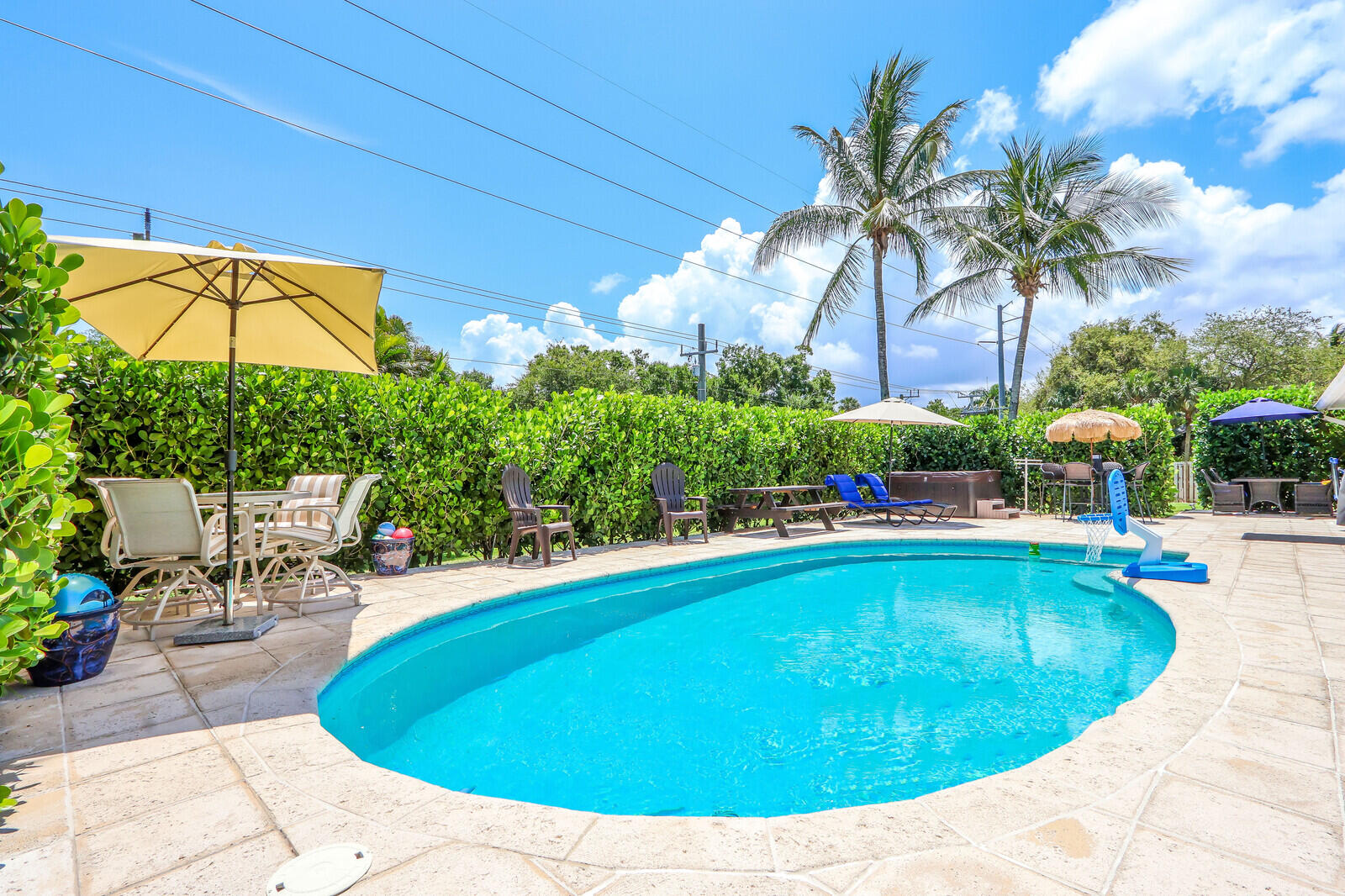 6009 Eagles Nest Drive Jupiter, FL 33458 - Photo 30 of 49 a view of a swimming pool with an outdoor seating