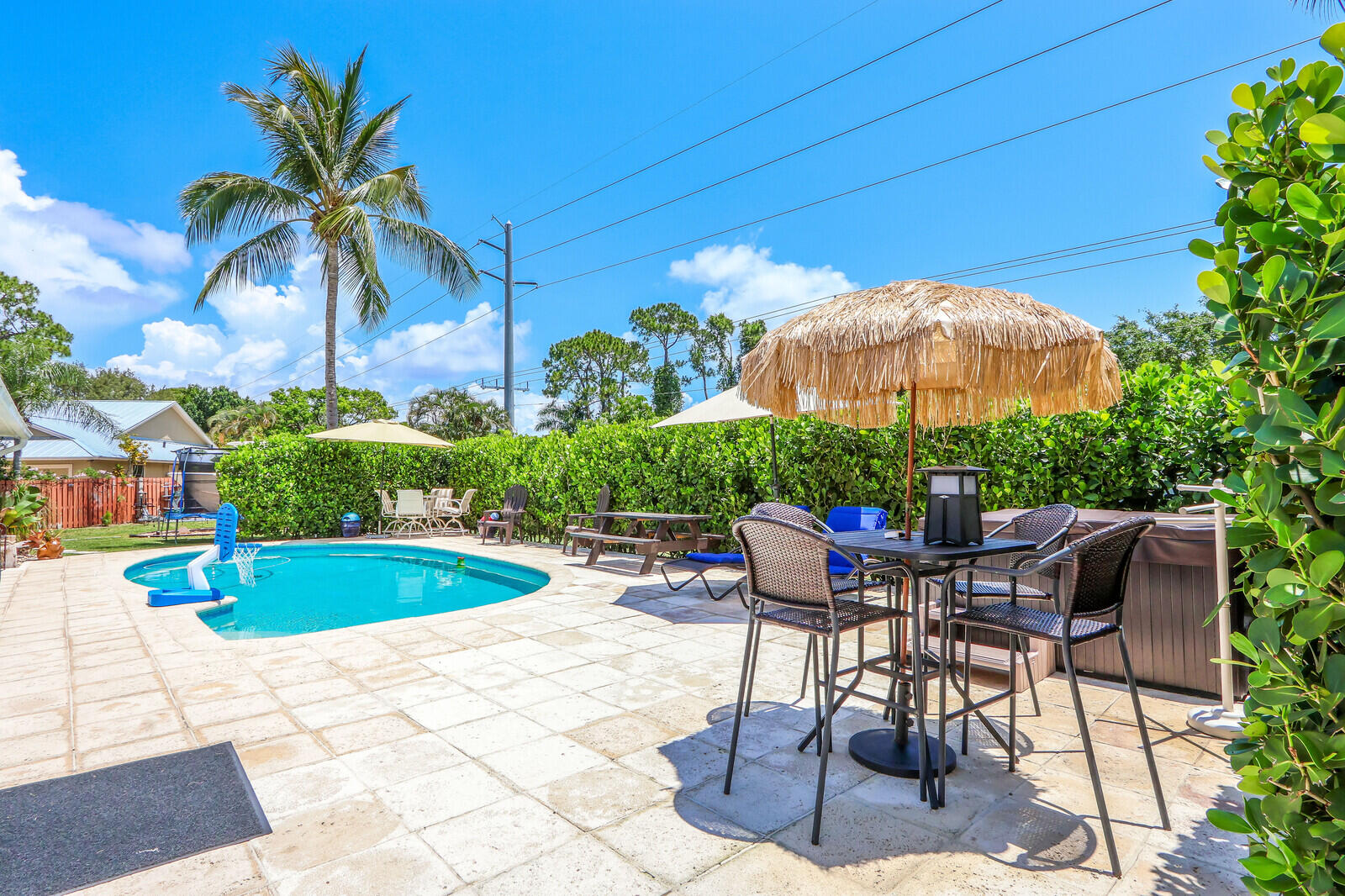 6009 Eagles Nest Drive Jupiter, FL 33458 - Photo 31 of 49 a view of a backyard with furniture and tub
