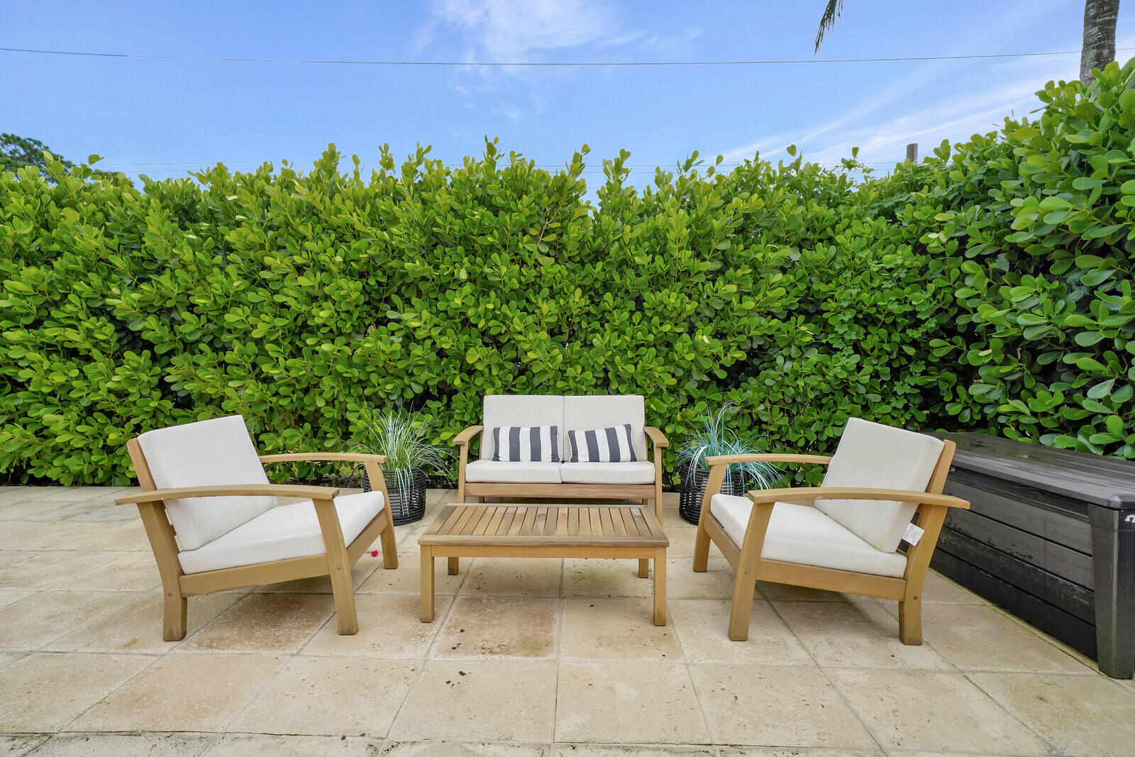6009 Eagles Nest Drive Jupiter, FL 33458 - Photo 33 of 49 a view of a chairs and table in the back yard of the house
