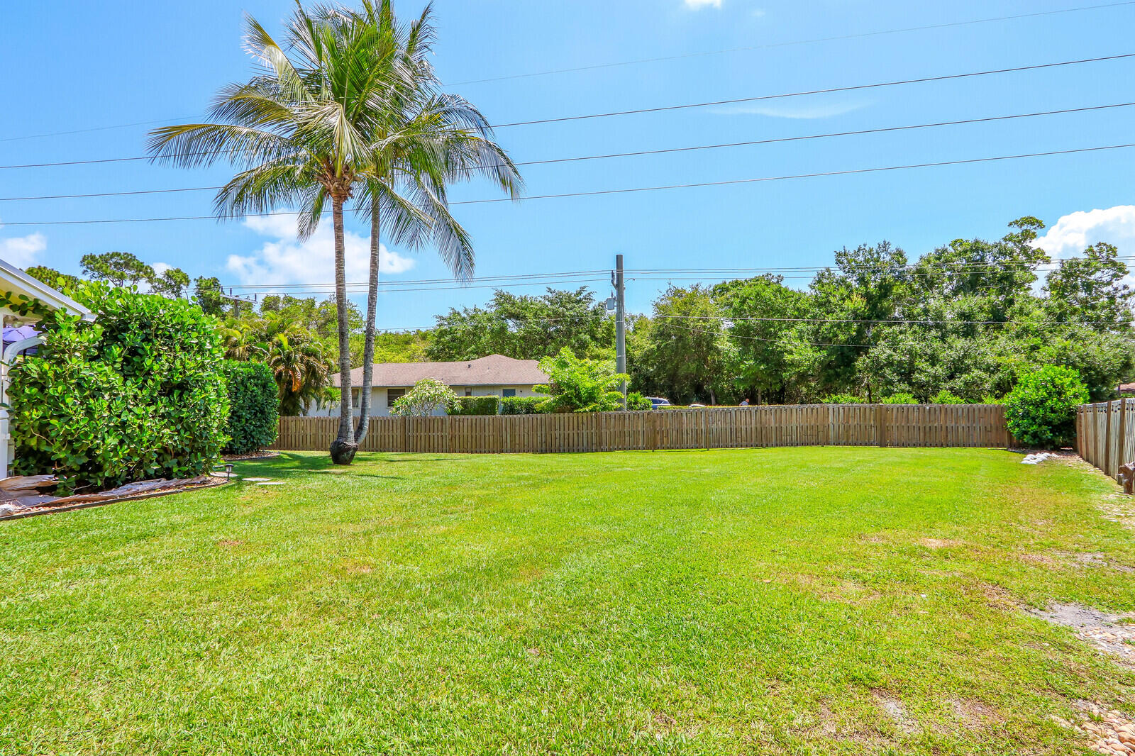 6009 Eagles Nest Drive Jupiter, FL 33458 - Photo 36 of 49 a view of a backyard with a garden