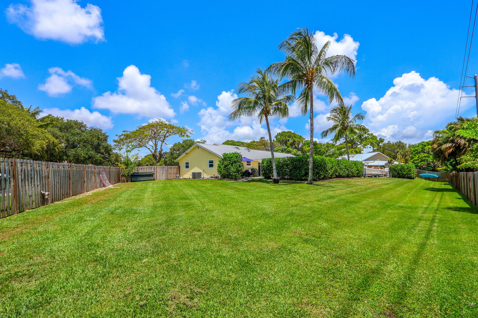 6009 Eagles Nest Drive Jupiter, FL 33458 - Photo 38 of 49 a view of a golf course with a house