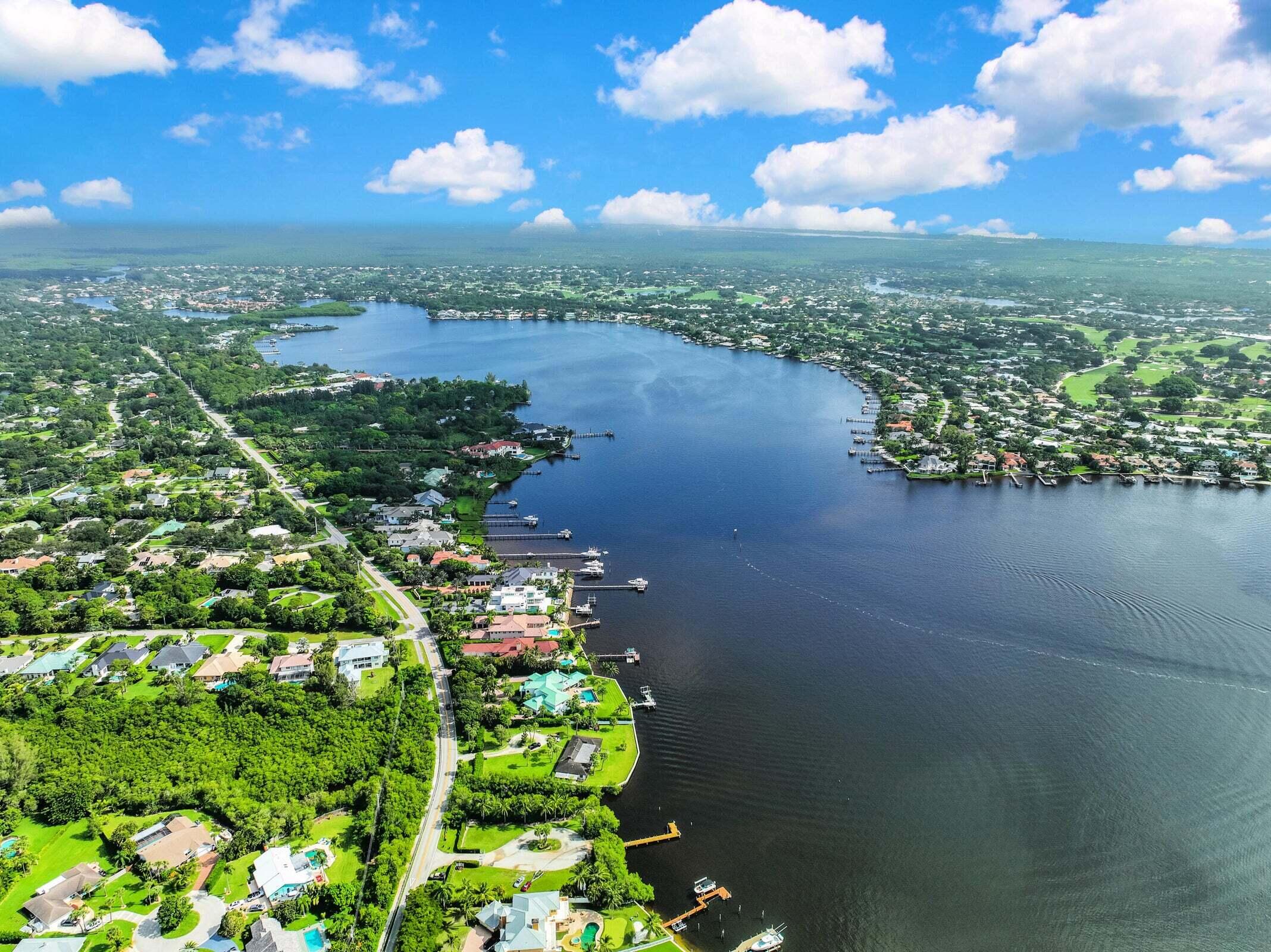 6009 Eagles Nest Drive Jupiter, FL 33458 - Photo 42 of 49 a view of a lake with a city