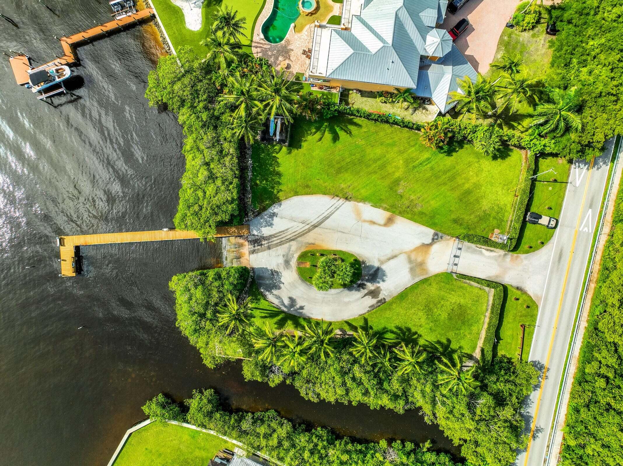 6009 Eagles Nest Drive Jupiter, FL 33458 - Photo 44 of 49 a view of a swimming pool with a yard