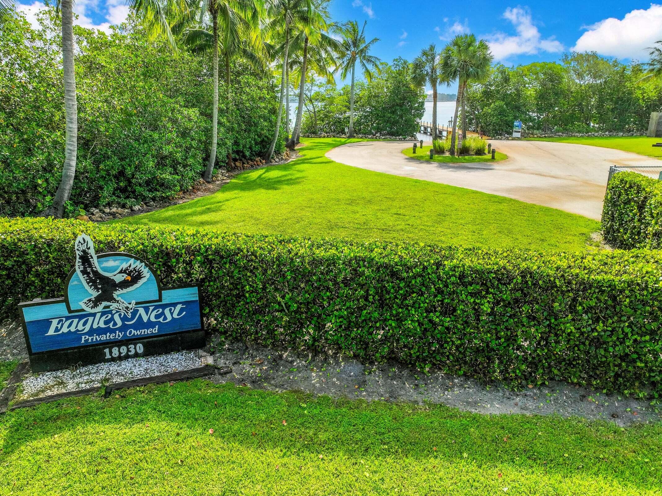 6009 Eagles Nest Drive Jupiter, FL 33458 - Photo 46 of 49 a view of a park with a bench and trees