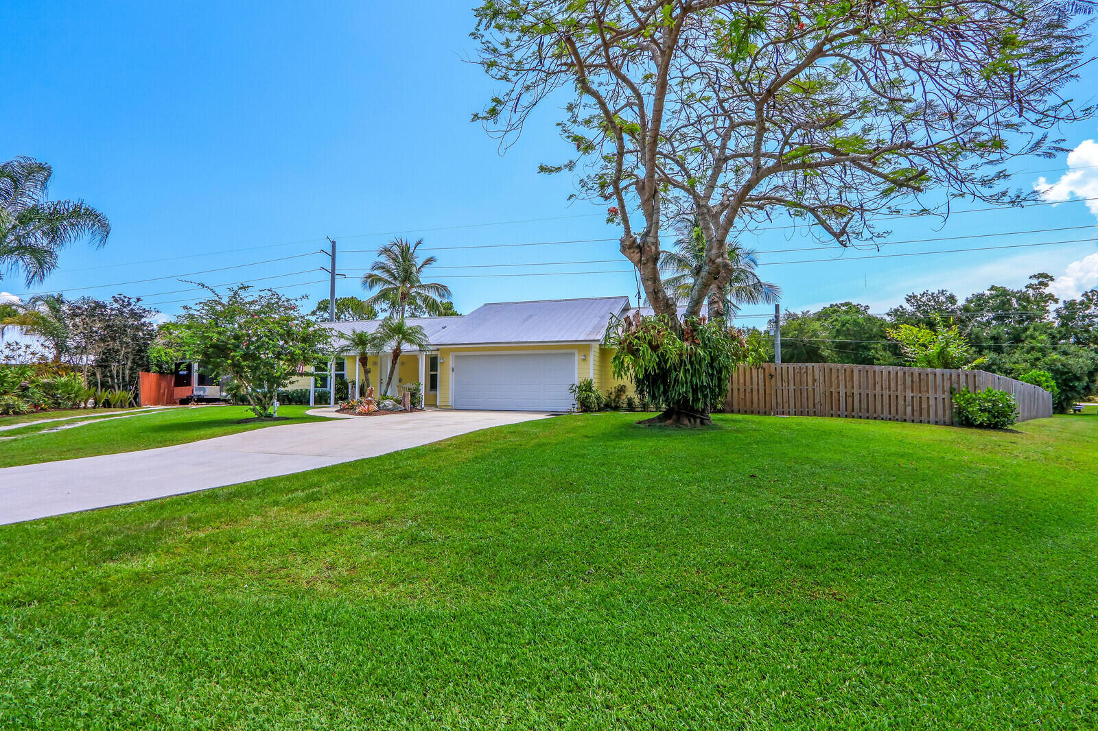 6009 Eagles Nest Drive Jupiter, FL 33458 - Photo 5 of 49 a view of a garden with a tree