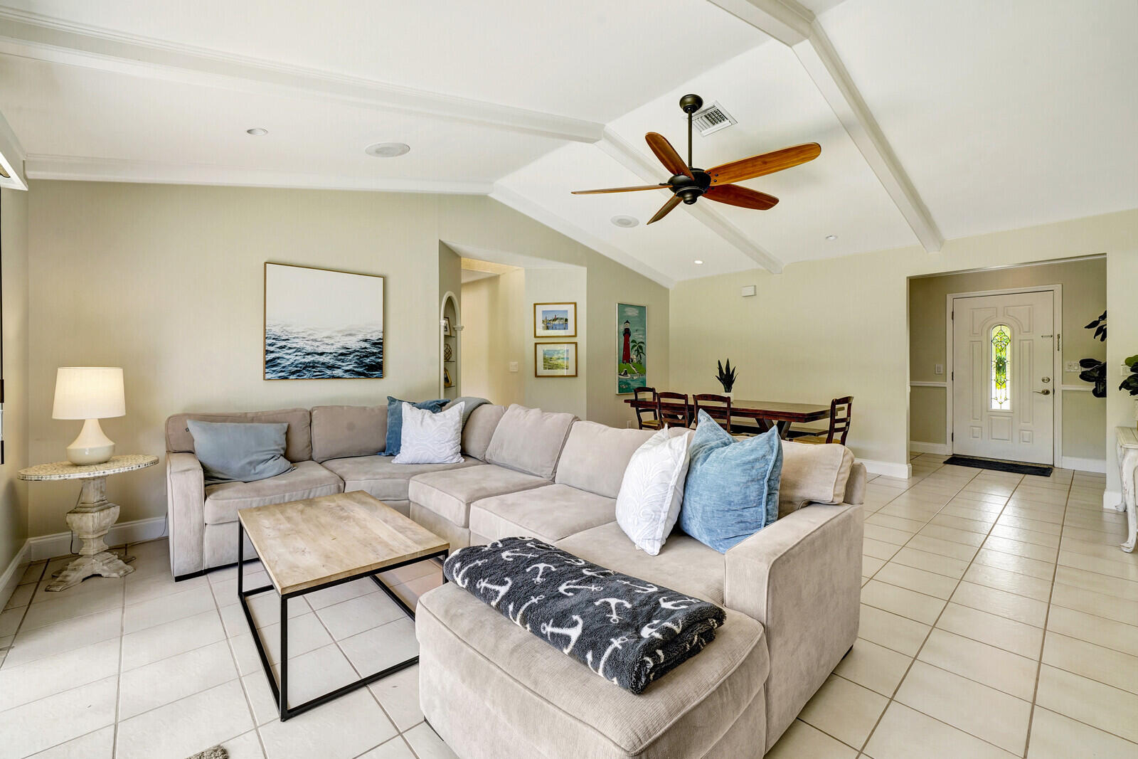 6009 Eagles Nest Drive Jupiter, FL 33458 - Photo 8 of 49 a living room with furniture and a ceiling fan