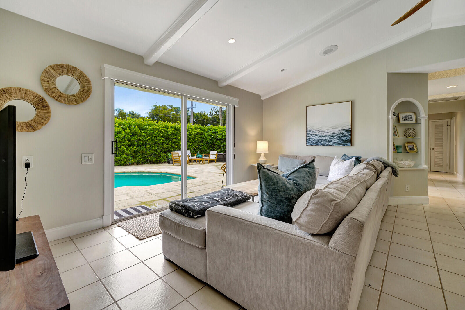 6009 Eagles Nest Drive Jupiter, FL 33458 - Photo 10 of 49 a living room with furniture and a floor to ceiling window