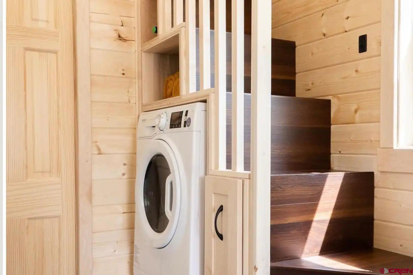 22130 6850 Road, Unit 210 Montrose, CO 81403 - Photo 16 of 35 a utility room with dryer and washer