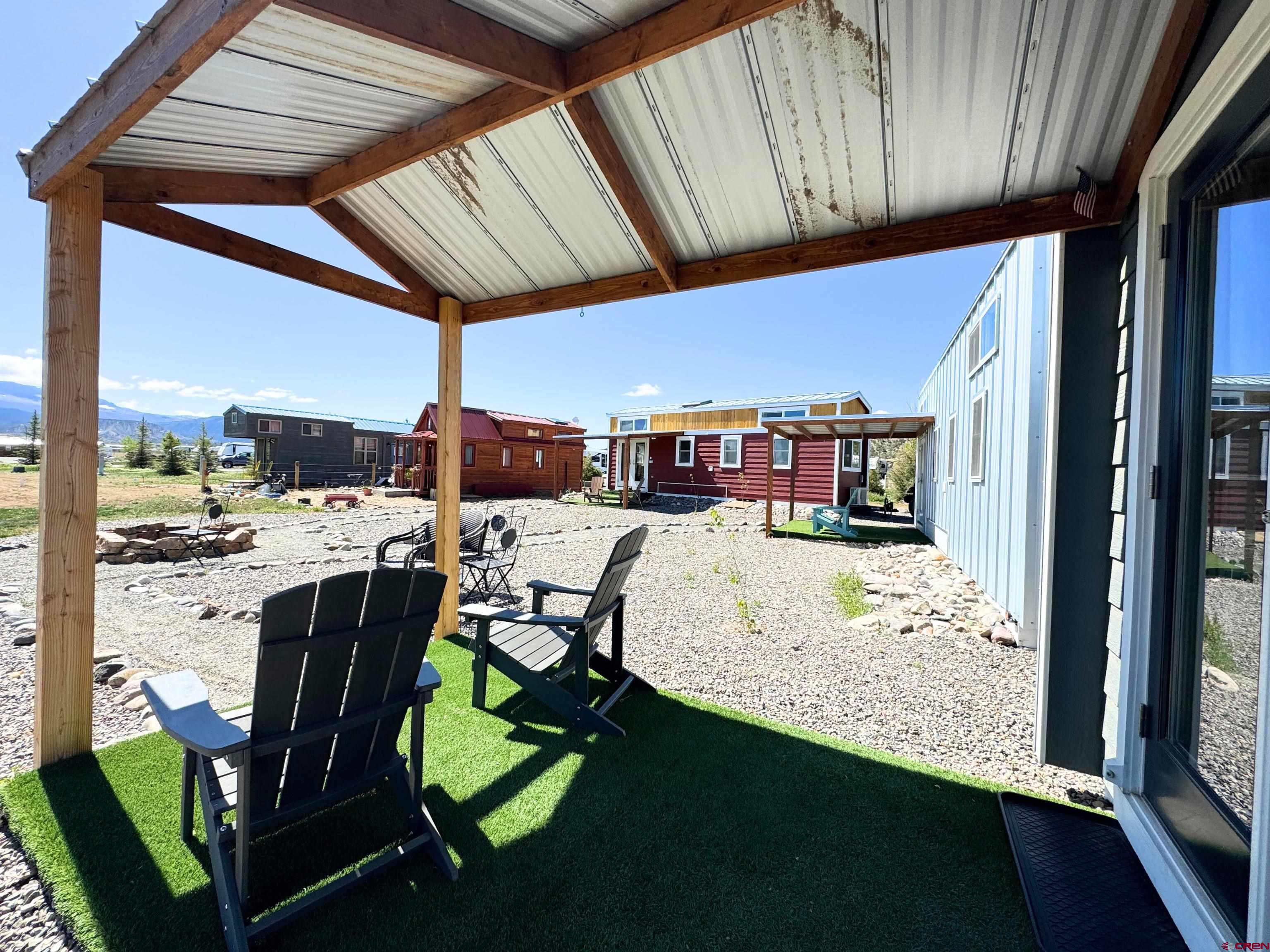 22130 6850 Road, Unit 210 Montrose, CO 81403 - Photo 21 of 35 a view of a chairs and table in the balcony