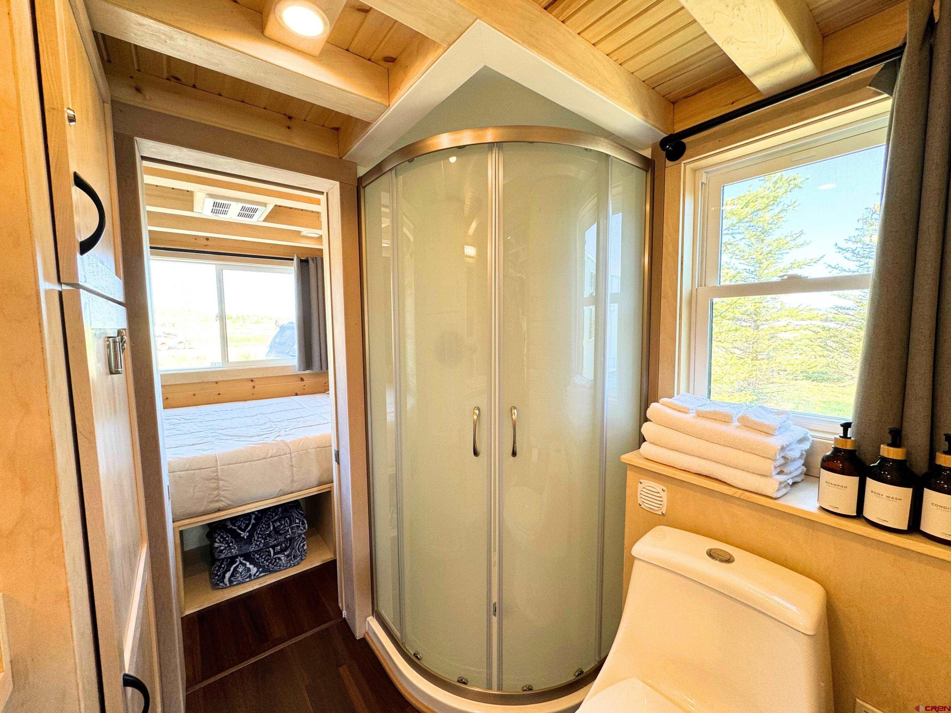22130 6850 Road, Unit 210 Montrose, CO 81403 - Photo 10 of 35 a bathroom with a sink and a mirror