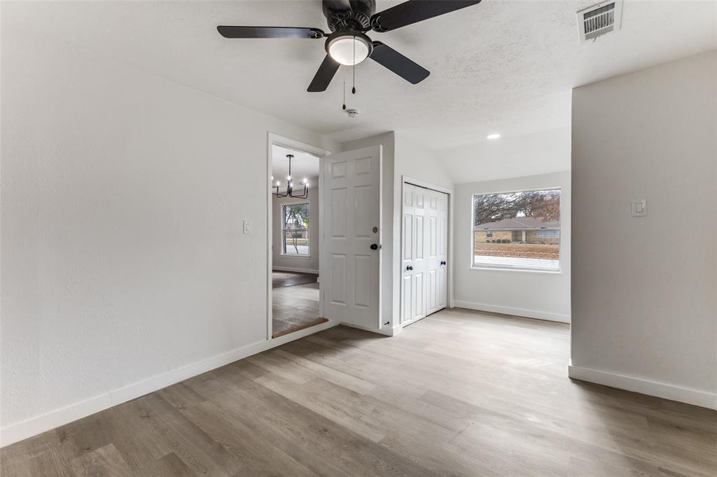 2723 Gus Thomasson Road Dallas, TX 75228 - Photo 13 of 26 wooden floor in an empty room with a window