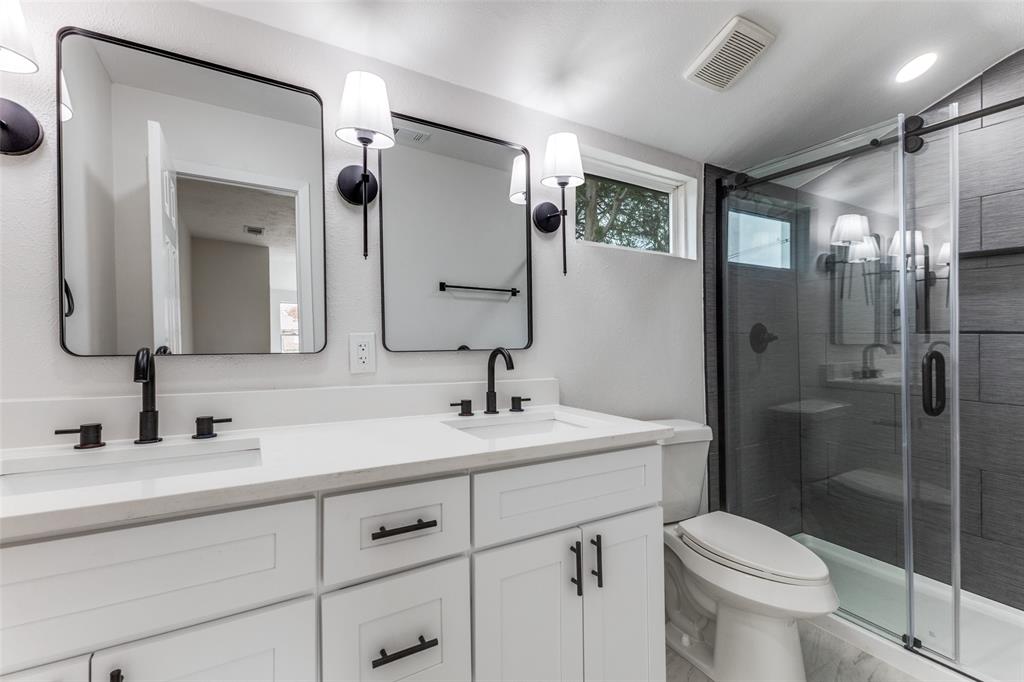 2723 Gus Thomasson Road Dallas, TX 75228 - Photo 15 of 26 a bathroom with a toilet sink and shower