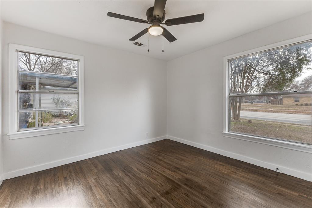 2723 Gus Thomasson Road Dallas, TX 75228 - Photo 16 of 26 a view of empty room with wooden floor and fan