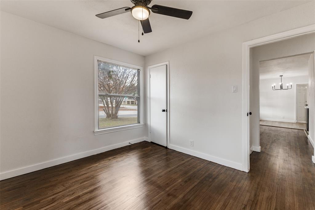 2723 Gus Thomasson Road Dallas, TX 75228 - Photo 17 of 26 a view of an empty room with wooden floor and a window