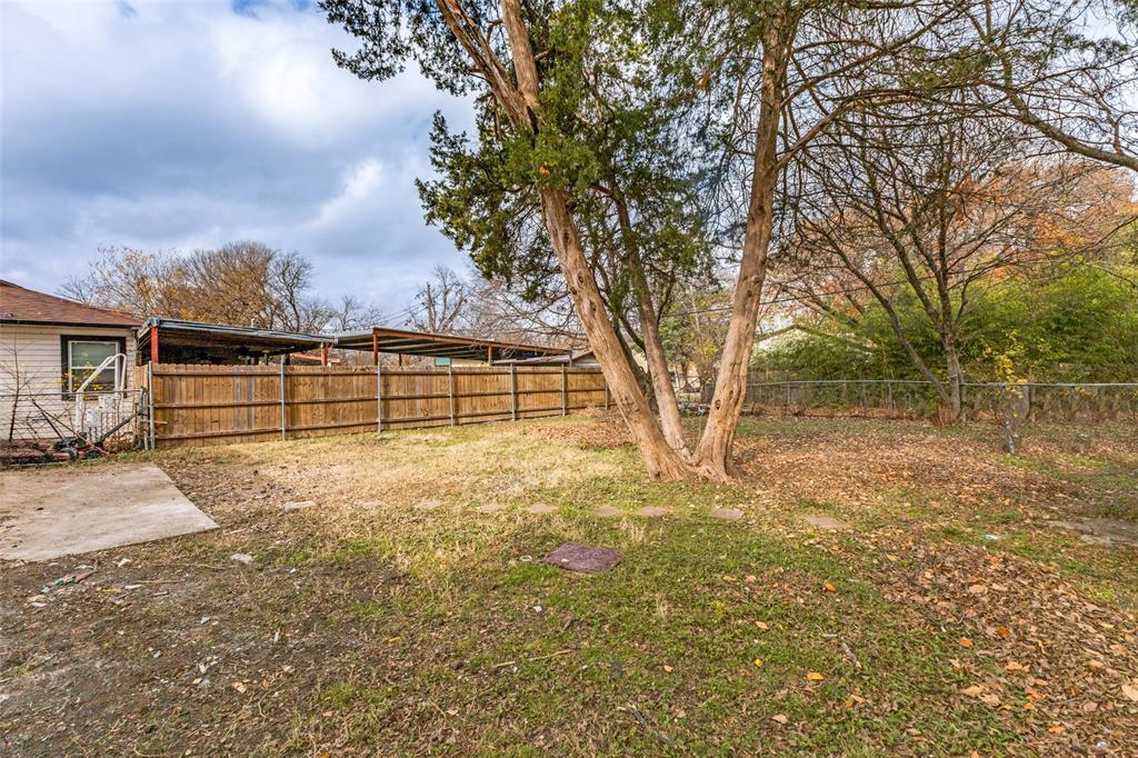 2723 Gus Thomasson Road Dallas, TX 75228 - Photo 24 of 26 a view of a yard with wooden fence