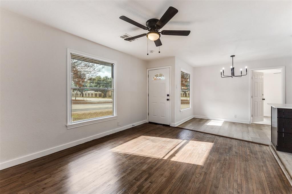 2723 Gus Thomasson Road Dallas, TX 75228 - Photo 5 of 26 a view of empty room with wooden floor and fan